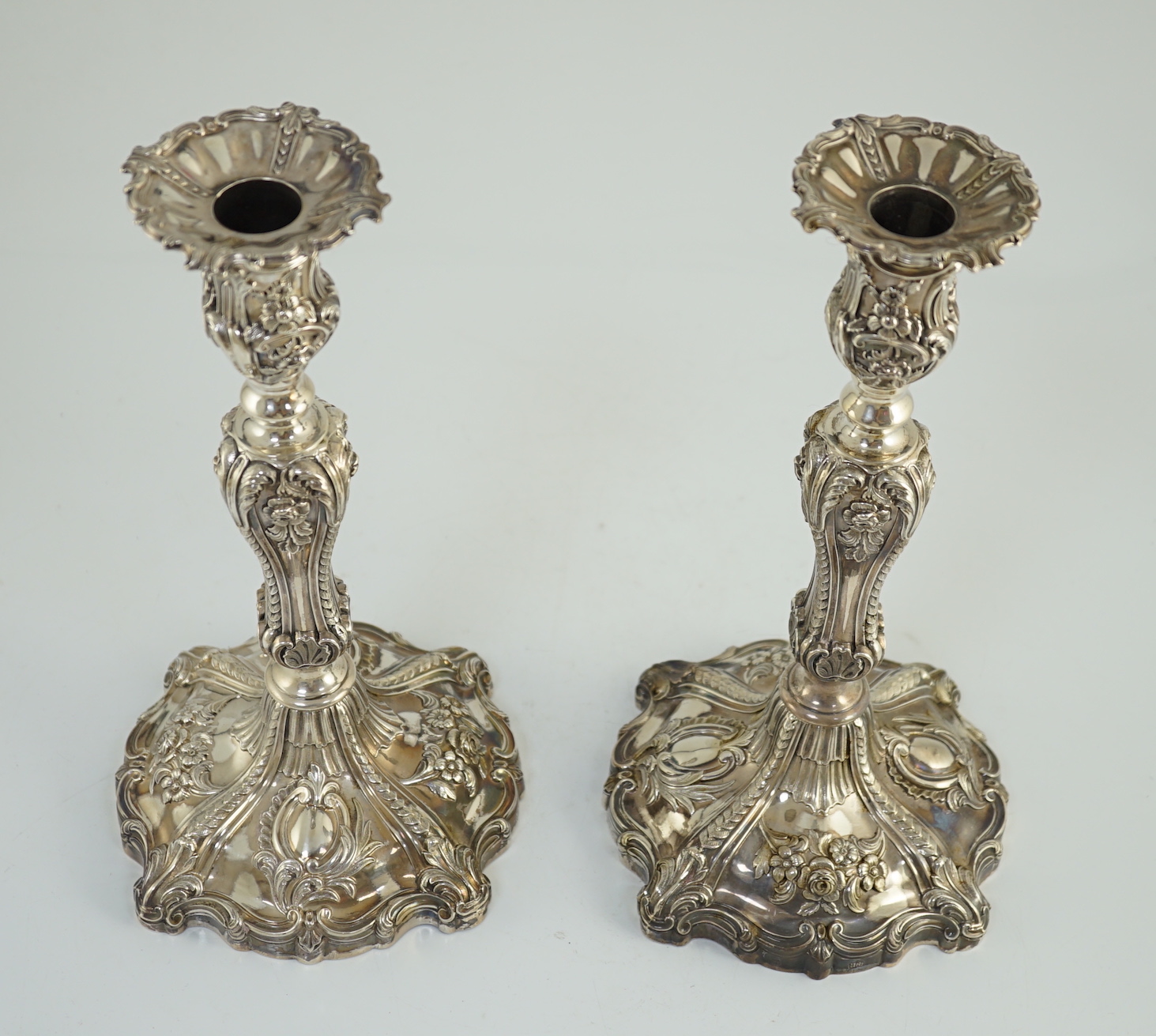 An ornate pair of early Victorian silver candlesticks by Creswick & Co